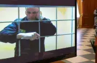 Аляксей Навальны за кратамі / Reuters
