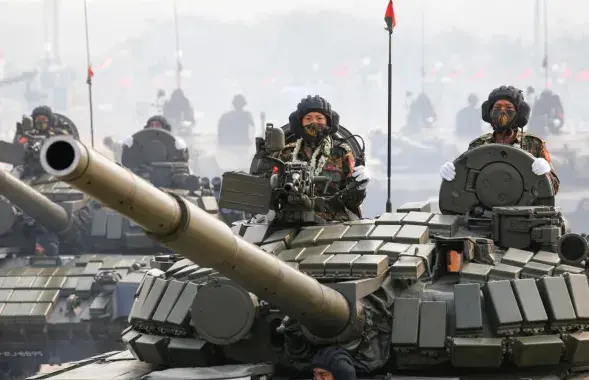 Soldiers on tanks taking part&nbsp;in Armed Forces Day parade in Myanmar / Reuters

