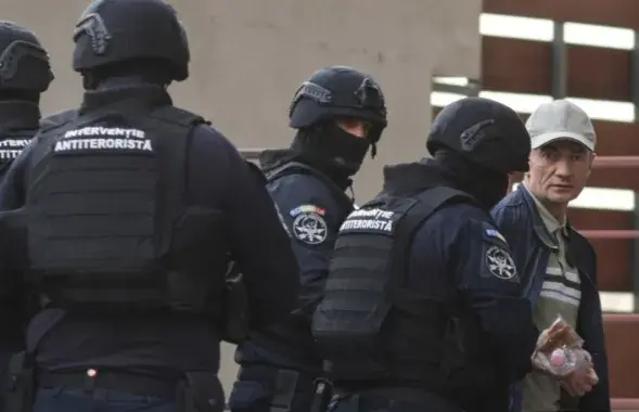 Alexandru Balan (right) was detained in Romania in September 2025
